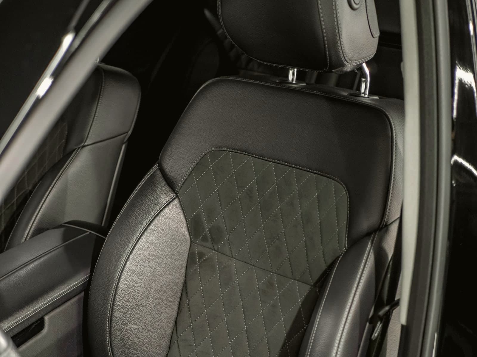 Clean leather car interior with conditioned seats and dashboard